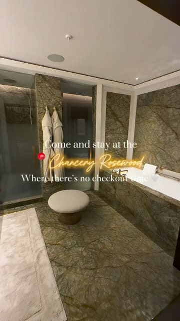 This video provides a comprehensive tour of The Chancery Rosewood, showcasing the luxury suites, the bathroom, the spa facilities, and the dining experiences. The creator uses a first-person perspective to guide the viewer through the hotel, highlighting the 'no checkout time' concept and the high-end interior design.