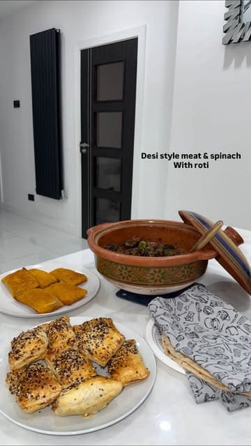 A home cooking tutorial demonstrating how to prepare a traditional Desi-style lamb and spinach dish (Palak Gosht) in a clay pot.