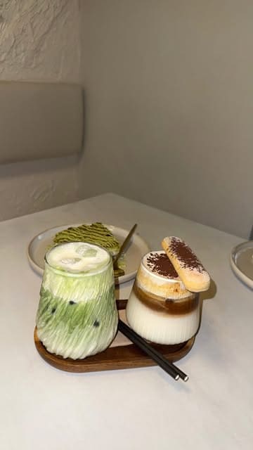 A short, aesthetic video showcasing the interior and menu items at Fika, a cafe in Bradford. The video features close-ups of matcha, an iced tiramisu latte, and various desserts, set to music with minimal text overlays.