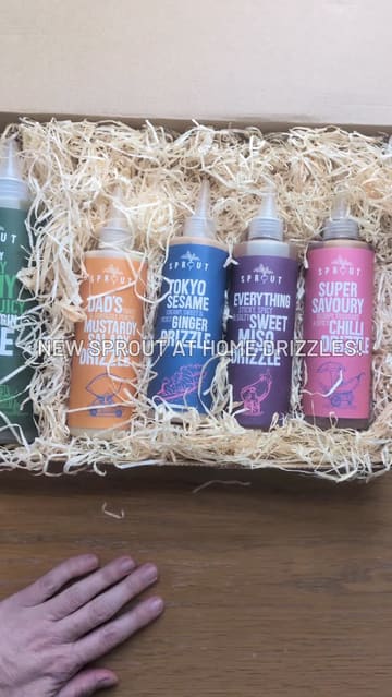 The video features an unboxing of a PR package containing various Sprout salad dressings, followed by a quick, POV-style demonstration of the creator assembling a fresh salad at home using the Dad's Mustardy Salady Drizzle. The content is casual, relatable, and focuses on the ease of using the products for a quick lunch.