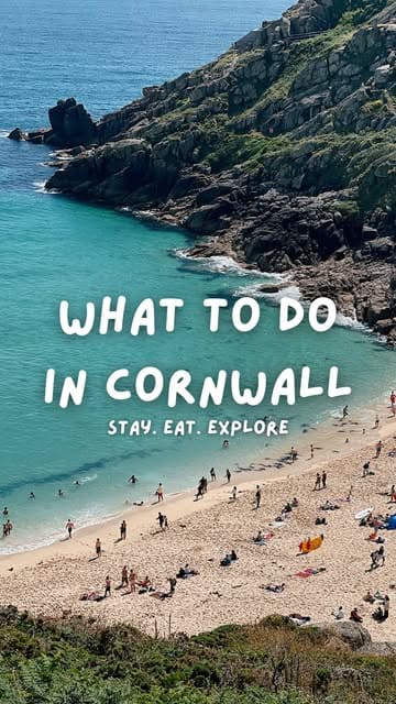 A high-angle, scenic landscape shot of a beach in Cornwall, used as a cover image for a travel listicle. The image features bright, natural daylight and clear, readable text overlay.