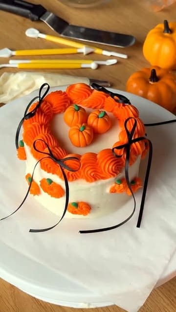 A promotional video for a 'Bento Cake' decorating workshop in West London, featuring the creator demonstrating the process, the social setting with attendees, and the final decorated cakes paired with prosecco.