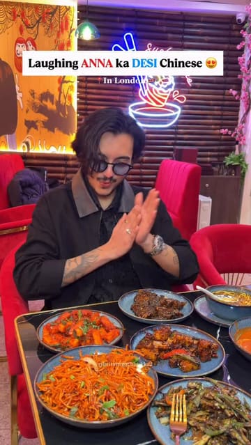 A high-energy vlog-style review of Wok & Spice in London, featuring the creator interacting with the chef and sampling a variety of Indo-Chinese dishes.