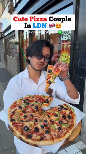 A couple visits D'lite Pizza in East London, showcasing their Indian-style pizzas, including a cheese burst option and stuffed garlic bread. The video highlights the affordability and the 'no onion, no garlic' menu options.