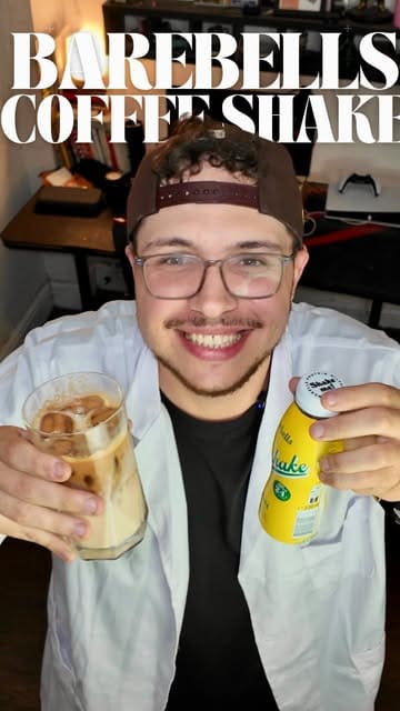 A high-energy, creator-led recipe tutorial demonstrating how to make a coffee protein milkshake using Barebells protein shakes and espresso.