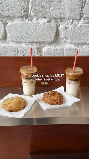 A short, punchy video showcasing a cookie shop in Glasgow. It features shots of the shop's interior, the display case filled with various cookies, and close-ups of the product, including a satisfying shot of a cookie being broken open.