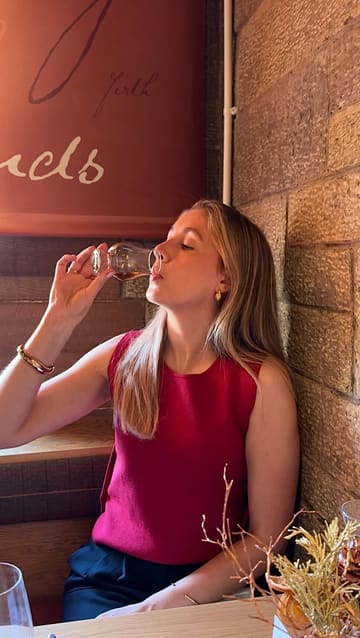 The video features a creator visiting The Scotch Whisky Experience and Amber Restaurant in Edinburgh to try their 'Taste of Scotland' menu. It includes shots of the venue, the tasting menu (starters, mains, dessert), and whisky pairings.