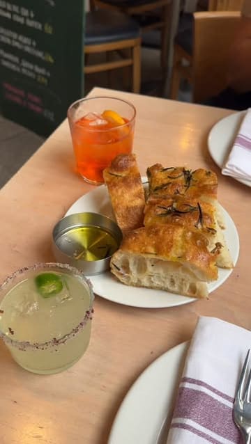 A creator visits Gloriosa in Glasgow, providing a review of their experience. The video features shots of the restaurant interior, the menu, and a variety of Mediterranean-inspired dishes and cocktails, accompanied by a voiceover sharing her positive impressions.