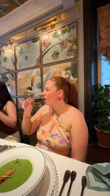 A vlog-style video documenting a visit to The Ivy in Glasgow to experience their 'Taste of Scotland' menu. The creator showcases the venue's interior, the table setting, the interactive terrarium-making activity, a live artist painting the scene, and various dishes and drinks from the menu.