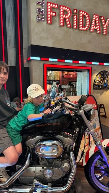 A relatable parenting-focused reel showing a family visiting TGI Fridays to take advantage of a 'kids eat free' promotion, using the restaurant as a solution to chaotic home life.