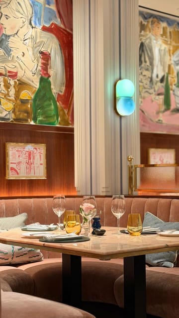 A visually appealing showcase of Rosi restaurant at The Beaumont Mayfair, featuring elegant interiors, tableside service, and signature dishes like beef tartare and a roast lunch.