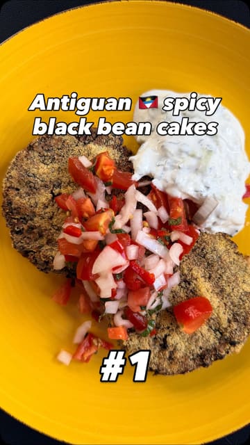 A home cooking tutorial demonstrating how to make spicy black bean cakes, featuring the creator singing and explaining the process.