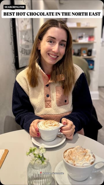 A creator visits Lagom, a specialty coffee bar in Newcastle, to review their hot chocolate. The video features the creator talking about the venue's atmosphere, showing the interior, the menu, and a close-up of the hot chocolate.