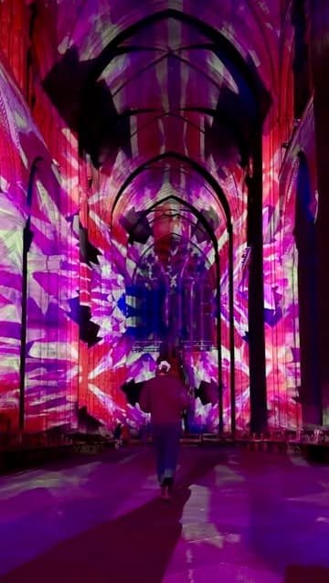 A montage of immersive light projections displayed inside Durham Cathedral, showcasing an event inspired by H.G. Wells' The Time Machine.