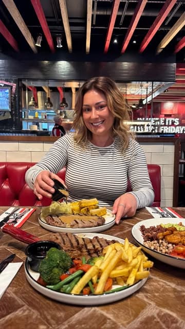 A food review video showcasing the new menu at TGI Fridays, featuring various dishes like steak, a prawn bowl, and mocktails.