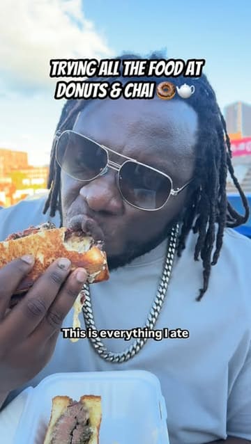 A high-energy food review video where the creator visits a food court in Birmingham called 'Donuts & Chai' and samples dishes from multiple vendors, including Caribbean, steak, sandwiches, loaded fries, birria tacos, Asian fusion, and donuts.
