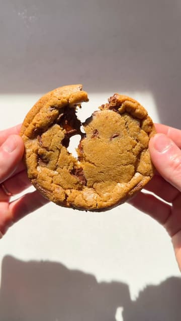 A recipe tutorial video demonstrating how to make chocolate chip cookies with salt on the bottom, promoting the creator's new cookbook 'The Science of Baking'.