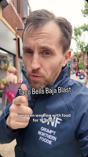 A creator reviews the Taco Bell Baja Blast drink, ordering it at a kiosk and sharing his thoughts on the taste.