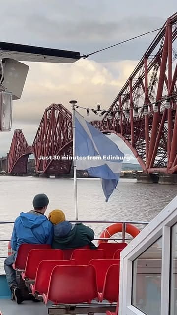 A travel reel showcasing a seasonal boat cruise on the Firth of Forth near Edinburgh, specifically highlighting the opportunity to see seal pups on Inchkeith Island.