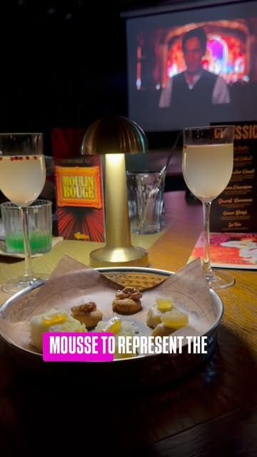 A review of an immersive cinema dining experience in Edinburgh called Taste Film, featuring a Moulin Rouge-themed seven-course meal paired with scenes from the movie.