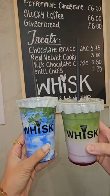 A short, upbeat reel showcasing a visit to Whisk cafe, featuring various matcha lattes, NYC-style cookies, and a chocolate cake. The video uses a montage style with frequent cuts to maintain interest, highlighting both the interior ambiance and the food/drink products.