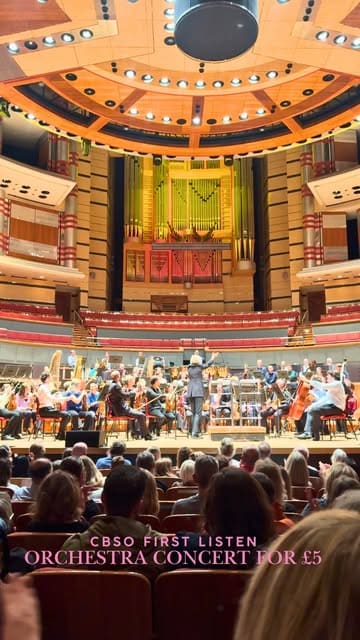 A vlog-style video showcasing the 'First Listen' orchestra experience at Symphony Hall in Birmingham, highlighting the behind-the-scenes tour, the concert, and the social aspect with drinks.