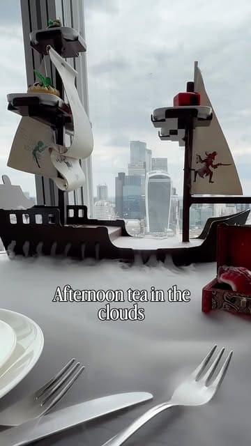 A short, engaging video showcasing the Peter Pan-themed afternoon tea at Aqua Shard in London. The footage highlights the unique presentation of the food, including a ship-shaped tea stand and themed pastries, alongside the impressive city views. A child is seen enjoying the experience, adding a personal and family-friendly touch to the review.