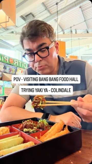 A first-person POV vlog review of a visit to the Yaki Ya! stall at Bang Bang Oriental Food Hall in Colindale. The creator orders a mixed starter box, chicken katsu curry, and yakisoba, and provides an honest review of the food and the atmosphere.