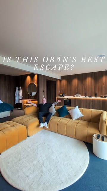 A travel vlog showcasing a luxury suite near Oban, Scotland, highlighting the room's amenities, the private hot tub, and local food experiences including fish and chips and fresh seafood.