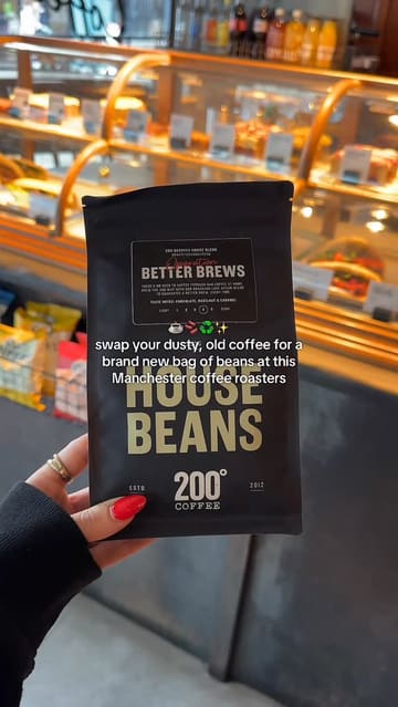 The video promotes a 'Coffee Amnesty' campaign at 200 Degrees coffee shop, where customers can exchange old instant coffee for a bag of fresh beans. It features quick shots of the amnesty bin, the coffee shop interior, and various food items like sandwiches and cake.