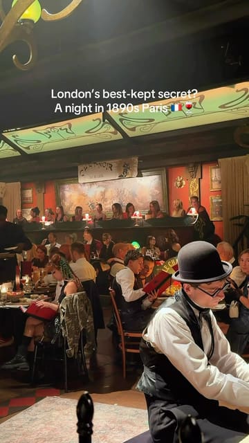 The video provides a montage of an immersive cabaret dining experience in London, themed around 1890s Paris. It features clips of live musicians, performers, and the venue's interior, interspersed with shots of the food served.