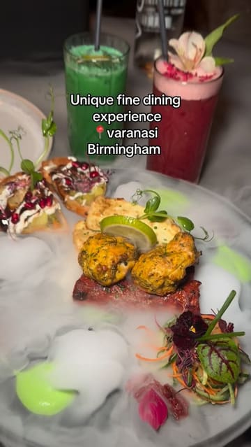 A montage of various dishes and drinks served at Varanasi in Birmingham, featuring close-ups of food presentation, including steaming biryani and cheese naan, set to music.