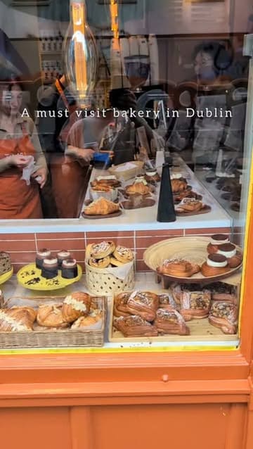 A short, punchy montage showcasing a variety of pastries at a bakery in Dublin, highlighting the visual appeal of the baked goods and the inviting storefront.
