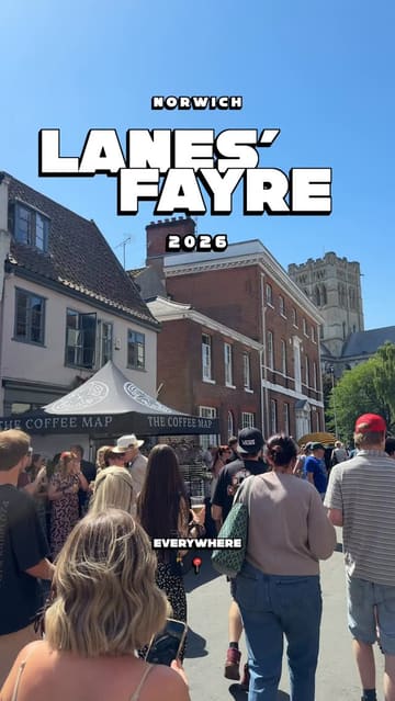 A fast-paced montage capturing the atmosphere of the Norwich Lanes' Fayre, featuring various street food stalls, crowds, and entertainment.