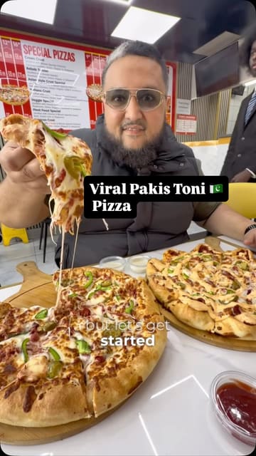 A food review video featuring a creator visiting BiTown Pizza in Birmingham to try their viral Pakistani-style pizza. The video includes shots of the pizza preparation, close-ups of the cheese-stuffed crust, and the creator tasting the food.