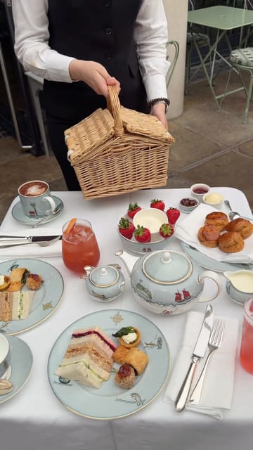 A promotional video for the Ham Yard Hotel featuring their Wimbledon-themed picnic afternoon tea served in a courtyard setting. The video highlights the food presentation and the outdoor atmosphere with tennis screenings in the background.