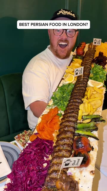 The creator visits Chef Javad, a Persian restaurant in London, to review their food after receiving recommendations. The video features close-ups of various dishes, including dips, kebabs, and rice, alongside the creator's enthusiastic commentary. It highlights the authenticity of the food, the value for money, and the impressive 1-meter kebab platter.