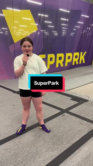 A young creator provides a tour of the new SuperPark activity venue in Glasgow, highlighting various attractions including trampolines, a running track, go-karts, an interactive floor, and basketball hoops.
