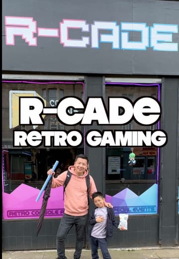 A creator visits R-Cade in Glasgow, a retro console arcade and cafe. The video highlights the variety of vintage gaming consoles available, the board game selection, and the casual cafe menu, including toasties and nostalgic snacks.