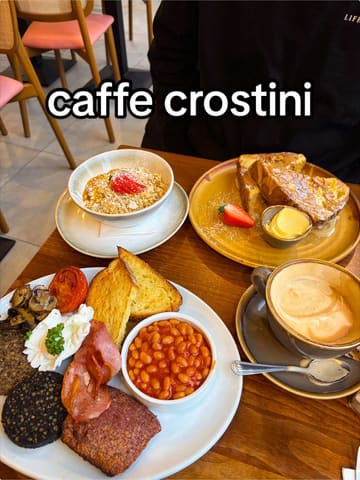 A vlog-style review of Caffe Crostini in Glasgow, featuring a full Scottish breakfast, Hong Kong-style French toast, and drinks. The creator highlights the cafe's aesthetic, food quality, and location, while sharing a personal anecdote about parking.