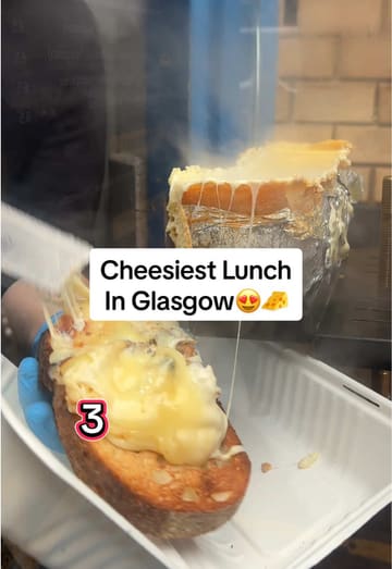A vlog-style review of Cheese Box Glasgow, a street food venue operating out of a converted police box. The video features the creator trying various cheese-based dishes including raclette, cheesy baguettes, and Basque cheesecake.