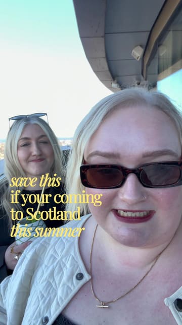 A vlog-style video featuring two creators recommending Joao's Place at the W Hotel in Edinburgh for its panoramic city views, suggesting it as a spot for drinks and sunset viewing, while also mentioning the adjacent Sushi Samba restaurant.