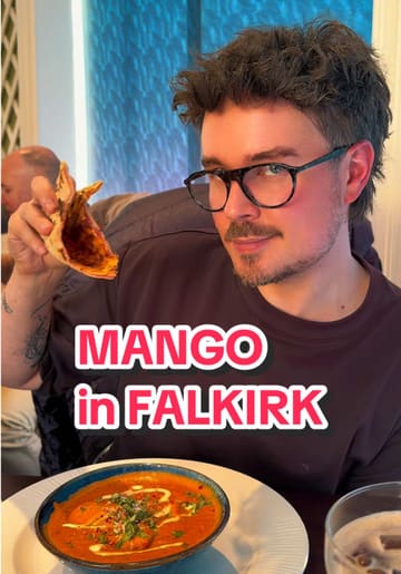 Two creators visit Mango restaurant in Falkirk to review their unique Indian-Italian fusion menu. They showcase the interior, drinks, and several dishes including haggis pakora, butter chicken lasagne, and desserts, providing a lively and personal review of their experience.