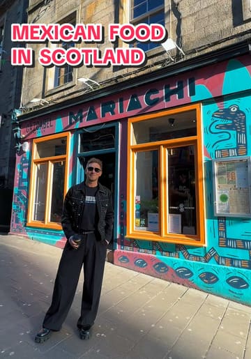 Two creators visit Mariachi, a Mexican restaurant in Edinburgh's Grassmarket. They provide a conversational review of their experience, highlighting the atmosphere, the menu, and specific dishes including nachos, guacamole, fajitas, and fish tacos. The video captures the casual, friendly vibe of the venue, including a glimpse of a dog inside.