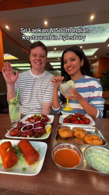 A couple visits Ceylon Dosa in Aylesbury to review their Sri Lankan and South Indian menu. The video features a variety of dishes including dosas, mutton rolls, devilled prawns, and biryani, while highlighting the restaurant's interior and current dining offers.