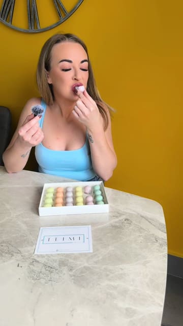 A creator unboxes and reviews a box of handmade, hand-painted artisan chocolates from Teimi, showcasing the variety of flavours and the texture of the chocolates.