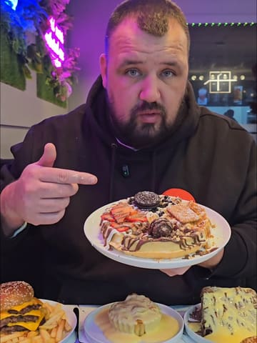 A review of Glacier Desserts in Ashton, featuring a variety of indulgent desserts like waffles, cornflake tart, and Matilda cake, as well as burgers.