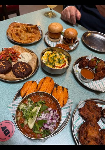 A father and daughter spend a day in Manchester visiting several popular hospitality venues, including Bundobust for Indian street food, Café Beermoth for craft beer, Schofield's Bar for cocktails, and Mollie's.