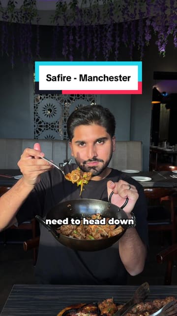A food review video featuring a creator visiting Safire in Manchester to showcase their new Karahi menu, including various curries, mixed grills, and mocktails.