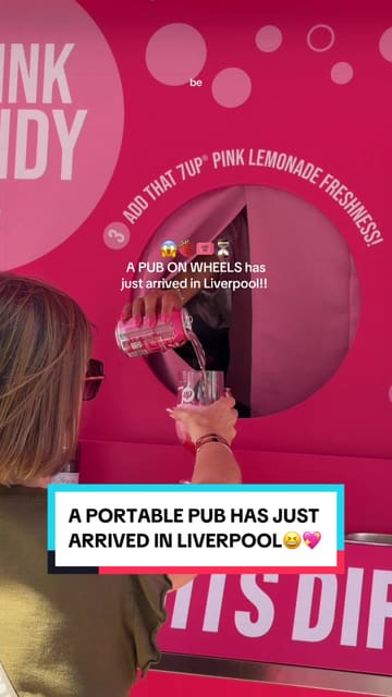 A promotional video featuring a 'pub on wheels' pop-up in Liverpool, showcasing the 7UP Pink Shandy 0% drink, the preparation process, and associated games like giant Jenga and cornhole.